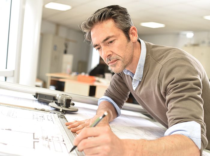 Drafting tables and display systems in a design studio