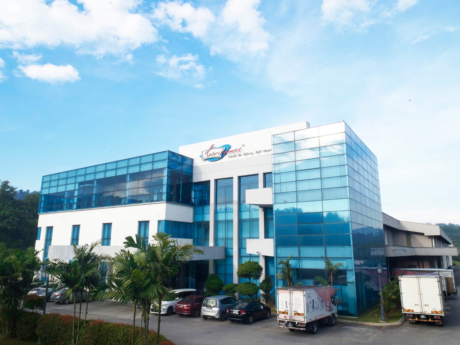 The WriteBest headquarters in Hulu Langat, Selangor, with delivery trucks outside